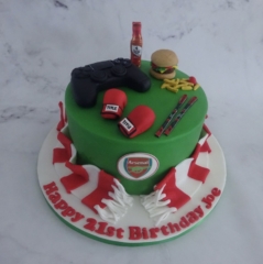 "Boxing, Football, Skiing and Playstation Themed Cake"