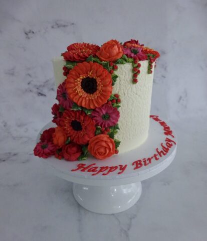 "Cascading Florals Cake Cerise and Orange"