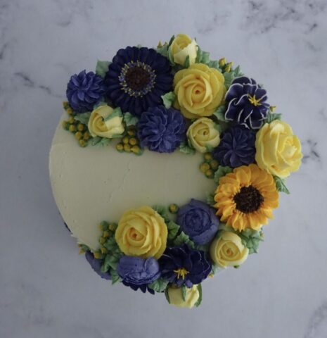 "Cascading Florals Cake Purple and Yellow Top View"