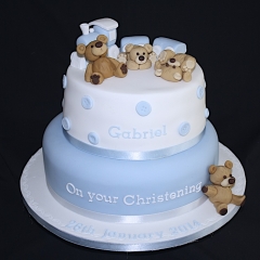 "Blue and White Two Tier Teddies and Train Christening Cake"